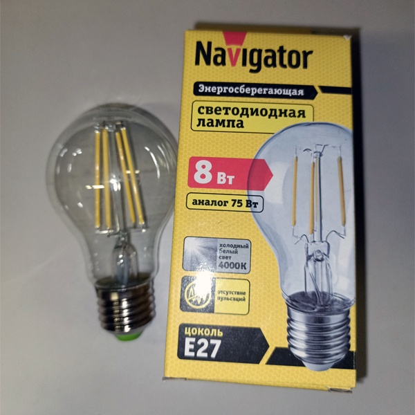Филаментная лампочка Навигатор с нитевидными светодиодами, мощностью 8 Ватт, с цоколем E27, нейтральный белый свет, прозрачная колба