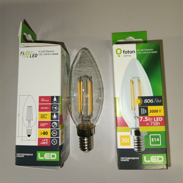 Энергосберегающая LED лампочка свеча с нитевидными светодиодами, мощностью 7,5 Ватт, с цоколем E14, теплый белый свет, прозрачная колба