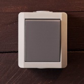 Выключатель одноклавишный открытой установки Kranz Industrial IP54 серый