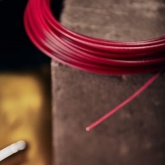 Трос стальной Rexant d2.5 мм в красной ПВХ изоляции, моток 20 метров