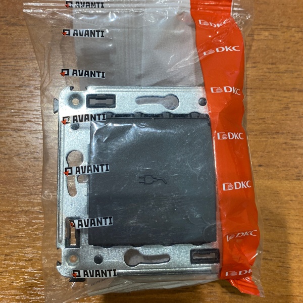 Розетка ДКС с защитными шторками и крышкой для скрытой установки, цвета черный матовый.