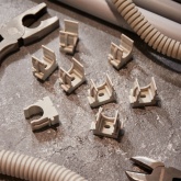 Крепеж-клипса Rexant для труб под монтажный пистолет в п/э d16 [упак.100шт] серая