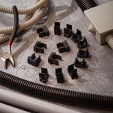 Крепеж-клипса Rexant для труб под монтажный пистолет в п/э d16 [упак.100шт] черная