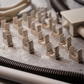 Крепеж-клипса Rexant для труб под монтажный пистолет в п/э d25 [упак.50шт] серая