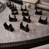 Крепеж-клипса Rexant для труб под монтажный пистолет в п/э d25 [упак.50шт] черная