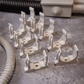 Крепеж-клипса Rexant для труб под монтажный пистолет в п/э d32 [упак.50шт] серая