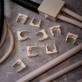 Крепеж-клипса Rexant для труб под монтажный пистолет в п/э d32 [упак.50шт] серая