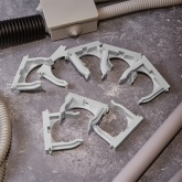 Крепеж-клипса Rexant для труб под монтажный пистолет в п/э d50 [упак.25шт] серая