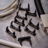 Крепеж-клипса Rexant для труб под монтажный пистолет в п/э d50 [упак.25шт] черная