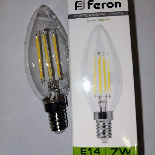 Энергосберегающая LED лампочка свеча с нитевидными светодиодами, мощностью 7 Ватт, с цоколем E14, нейтральный белый свет, прозрачная колба