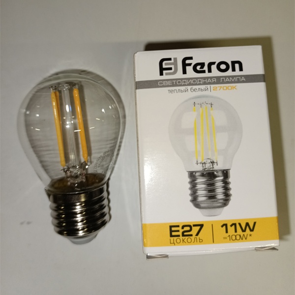 Филаментная лампочка шарик Ферон с нитевидными светодиодами, мощностью 11 Ватт, с цоколем E27, теплый свет, прозрачная колба