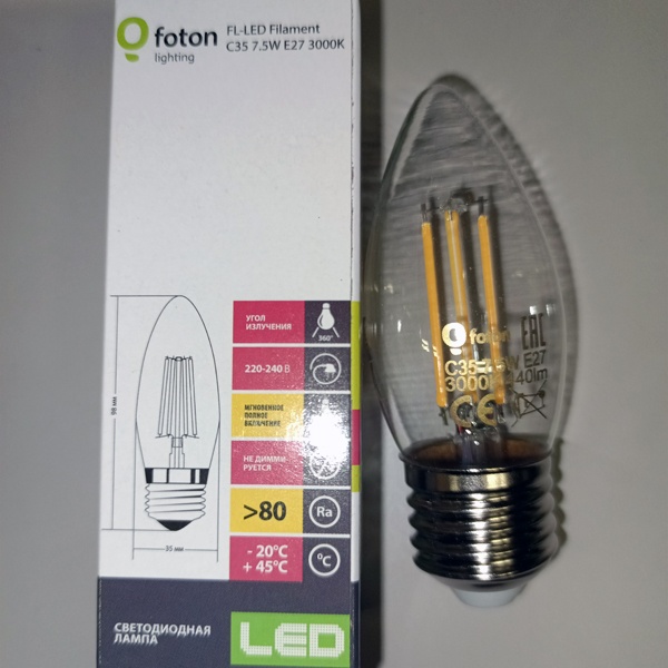 Энергосберегающая LED лампочка свеча с нитевидными светодиодами, мощностью 7,5 Ватт, с цоколем E27, теплый белый свет, прозрачная колба