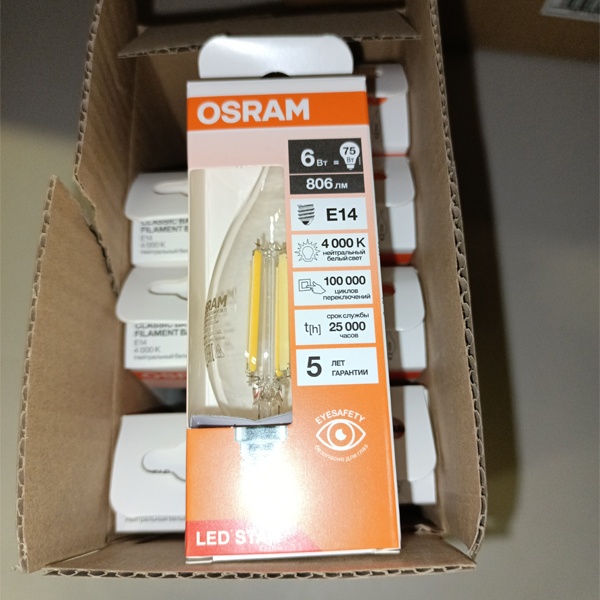 Филаментная лампочка формы свеча на ветру с нитевидными светодиодами Осрам мощностью 6 Ватт, с цоколем E14 (миньон), нейтральный белый свет, прозрачная колба