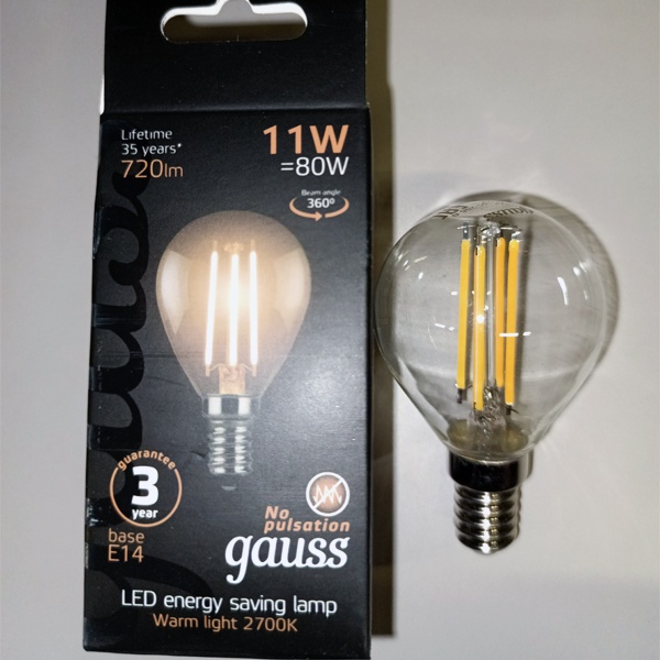 Филаментная лампочка шарик с нитевидными светодиодами Гаусс, мощностью 11 Ватт, с цоколем E14, теплый свет, прозрачная колба