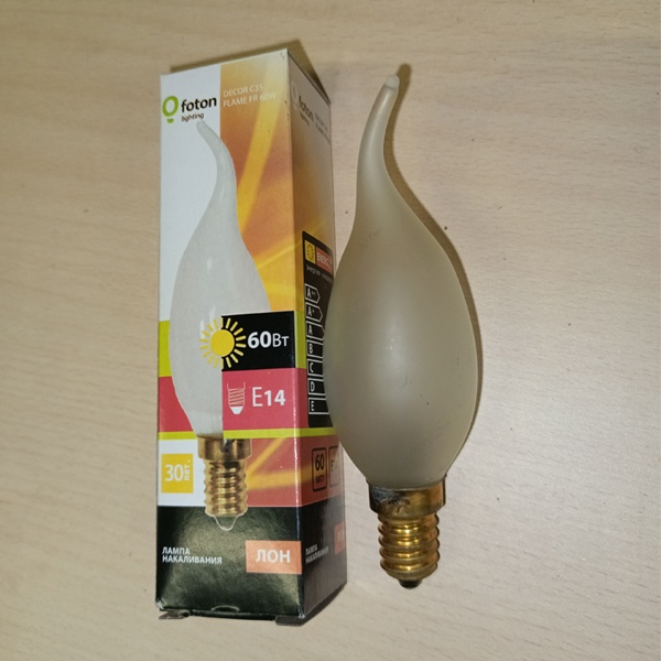 Обычная вольфрамовая лампа формы свеча на ветру мощностью 60 Вт на 220 Вольт с цоколем E14 миньон общего назначения