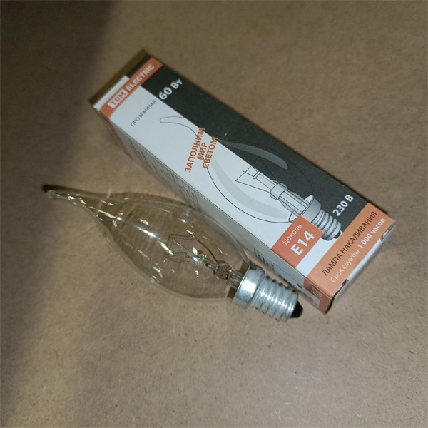 Обычная вольфрамовая лампа формы свеча на ветру мощностью 60 Вт на 220 Вольт с цоколем E14 миньон общего назначения