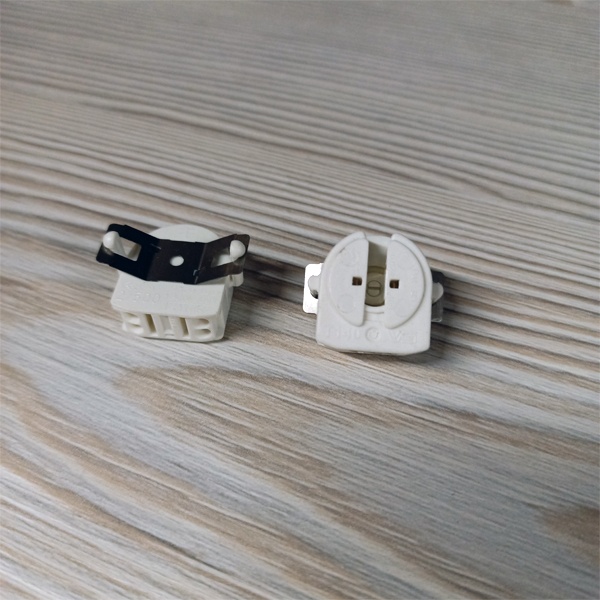 Вращающийся патрон G5 с торцовыми защёлками диаметром 3,8 мм для линейных люминесцентных ламп Т5, с горизонтальной компенсирующей пружиной