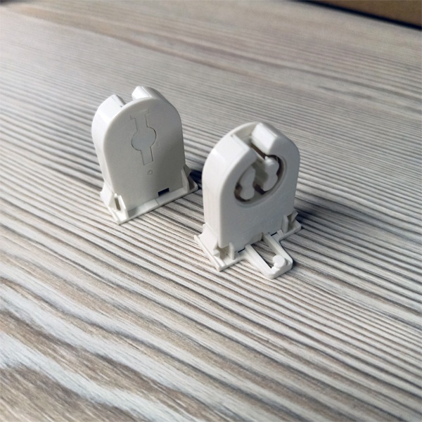 Сквозной патрон G13 с боковыми защелками и стопором для линейных люминесцентных ламп Т8.