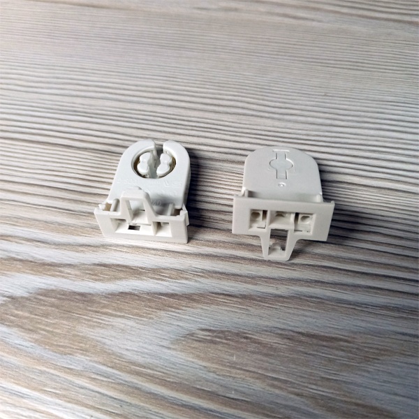 Сквозной патрон G13 с боковыми защелками и стопором для линейных люминесцентных ламп Т8.